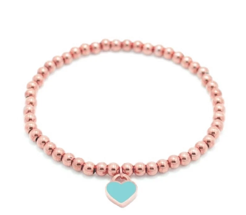 Pulsera de cuentas con corazones en oro rosa, en colores vibrantes azul, rojo, rosa y verde. Diseño fresco y divertido